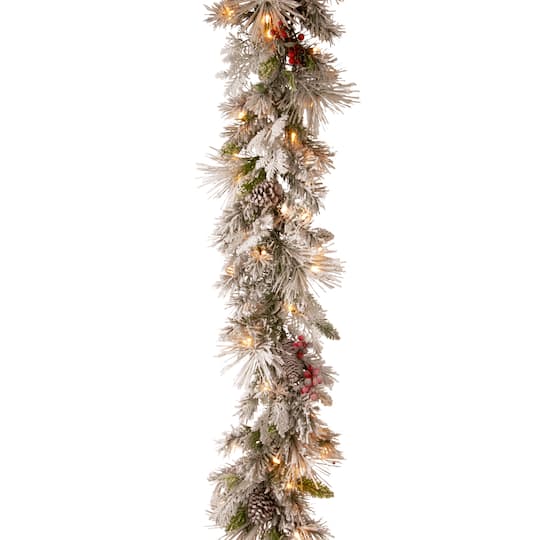 9ft. Pre-lit Snowy Bedford Pine Artificial Christmas Garland with Cedar Leaves, Red Berries, Mixed Cones &#x26; 70 Warm White Battery Operated LED Lights w/Timer